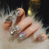 24Pcs Pink Glossy Medium Almond Fake Nails Press on Glitter Shining Heart with Rhinestone Pearl Deisgn False Nails Tips Stick LANFUBEISI